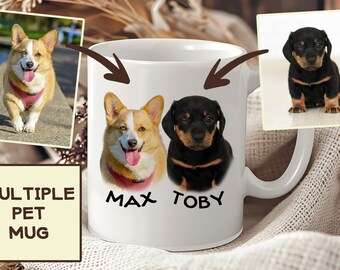 May include: White ceramic mug with two dog portraits, a corgi and a dachshund, with the names "Max" and "Toby" printed below. The mug is on a beige fabric surface.