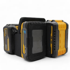 May include: Two yellow and black 20V 5.0Ah batteries with a black battery holder. The batteries have a black and gray display screen and the text "20V/5.0Ah" and "20V/6.0Ah" printed on them.