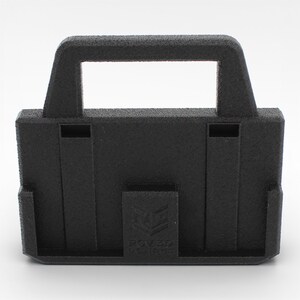 May include: A black, rectangular 3D-printed object with a handle and a rectangular opening. The object has a textured surface and a small rectangular logo on the front. The object has two vertical slots on the front.