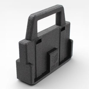 May include: A black, textured, rectangular object with a handle. The object has a boxy shape with a handle on top and a logo that reads "RGV 3D DESIGNS". The object appears to be 3D printed.