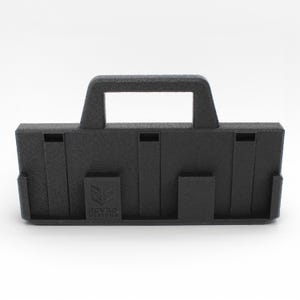 May include: A black, rectangular 3D-printed object with a handle and several slots. The object has a textured surface and the text "RGV 3D DESIGNS" is visible on the front. The design appears to be a carrying case or organizer.