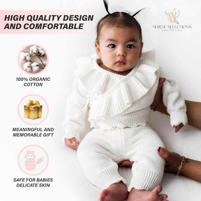 May include: A white knitted baby outfit with a ruffled top and matching pants. The outfit is made of 100% organic cotton and is safe for babies' delicate skin. The text "HIGH QUALITY DESIGN AND COMFORTABLE" is at the top of the image. The text "100% ORGANIC COTTON" is in a pink box with a white cotton ball image. The text "MEANINGFUL AND MEMORABLE GIFT" is in a pink box with a gold gift box image. The text "SAFE FOR BABIES DELICATE SKIN" is in a pink box with a baby image. The text "SERENE SELECTIONS" is at the top right of the image.