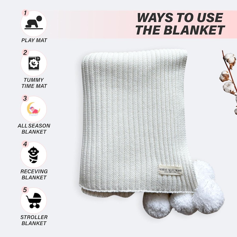 May include: A white knitted baby blanket with pom-poms on the corners. The blanket is folded and displayed on a white background. The text "WAYS TO USE THE BLANKET" is displayed above the blanket. Five icons are displayed on the left side of the image, showing different ways to use the blanket, such as a play mat, tummy time mat, all-season blanket, receiving blanket, and stroller blanket.