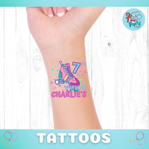 May include: A temporary tattoo featuring a pink roller skate with rainbow stripes and a blue number 7. The tattoo also includes the text "7th Birthday Charlie's" in pink and blue.