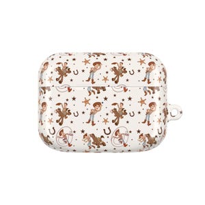 May include: White AirPod case with a repeating pattern of a cowboy character, horses, stars, and horseshoes. The case has a rounded rectangular shape with a small loop on the side. The design features brown, tan, and blue colors.