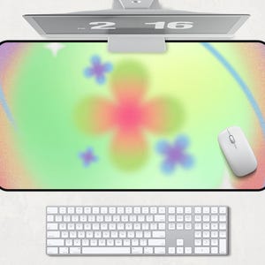 Puede incluir: Un diseño abstracto colorido con una gran cruz rosa, amarilla y verde en el centro. El fondo es un degradado de verde claro, amarillo y rosa. Hay cuatro formas de flores más pequeñas alrededor de la cruz.