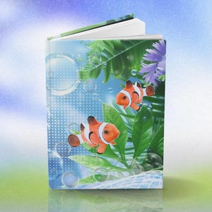 May include: A hardcover book with a vibrant illustration of two orange and white clownfish swimming among green plants and bubbles. The cover features a blue background with a dotted pattern and a hint of purple flowers.