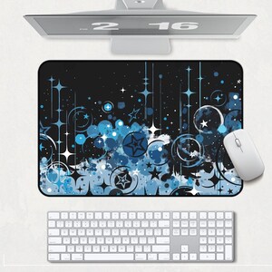 May include: A blue and white abstract design mouse pad with a black background. The design features stars, circles, and swirls.