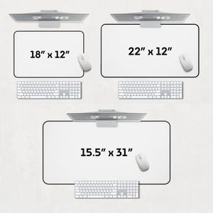 May include: Three different sizes of white desk mats with black borders. The mats are labeled with their dimensions: 18" x 12", 22" x 12", and 15.5" x 31".
