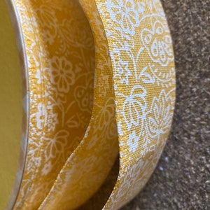 Yellow ribbon with flower pattern