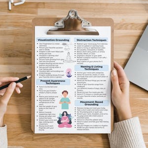 May include: A clipboard with mindfulness techniques for grounding, present awareness, distraction, naming, and movement. The techniques are organized into sections with bullet points and illustrations. A hand holds a pencil, and another holds the clipboard.