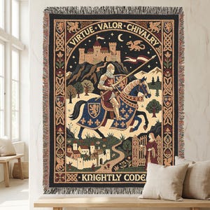 May include: A woven throw blanket featuring a medieval scene with a knight on horseback, a castle, and a dragon. The text reads VIRTUE VALOR CHIVALRY at the top and KNIGHTLY CODE at the bottom. The design includes a decorative border with intricate patterns.