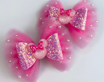 Pink Minnie Mouse pigtail set.