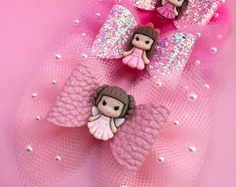 Ballerina hair bows.