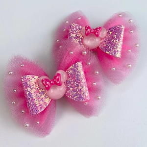 Pink Minnie Mouse pigtail set.