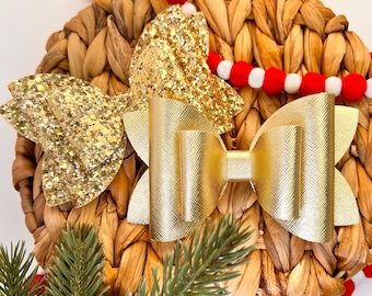 Gold hair bow.