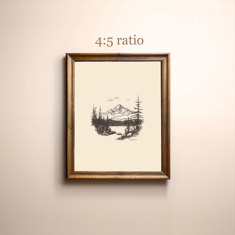 May include: A black and white line drawing of a mountain range with a lake in the foreground. The drawing is framed in a wooden frame with the text "4:5 ratio" printed above the image.