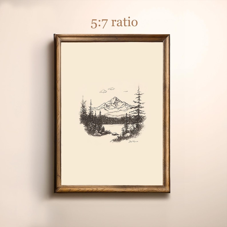 May include: A black and white line drawing of a mountain range with a lake in the foreground. The drawing is framed in a brown wooden frame.