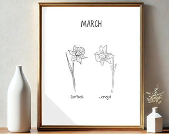 May include: A framed print featuring line drawings of a daffodil and a jonquil, with the word "MARCH" at the top. The flowers are in black and white, set against a white background. The print is in a gold frame.