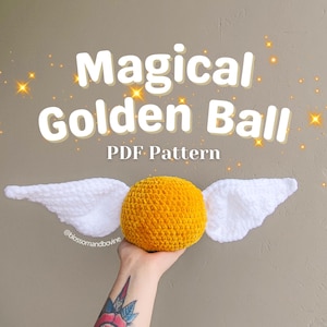 May include: A crocheted golden snitch with white wings. The snitch is a popular item in the Harry Potter universe. PDF pattern.