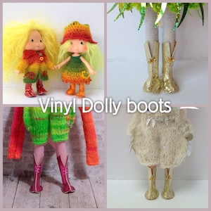 May include: Three pairs of vinyl doll boots. The first pair is gold with a pointed toe. The second pair is pink with a rounded toe. The third pair is gold with a rounded toe.