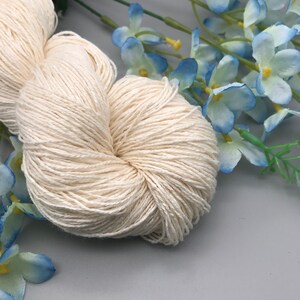 May include: A skein of natural white cotton yarn, perfect for knitting or crocheting projects.