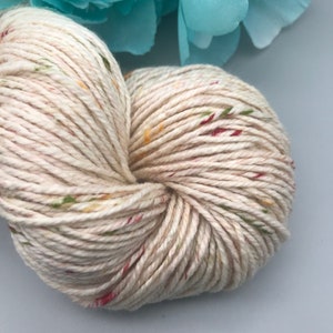 May include: A set of three ceramic vases in varying heights. The vases are white with a textured, ridged design. The tallest vase is approximately 10 inches tall, the medium vase is 8 inches, and the smallest is 6 inches.