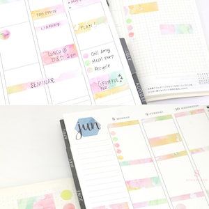 May include: A close-up of a monthly planner with watercolor-style stickers. The planner has tabs for each month, and the stickers are in various colors, including pink, yellow, green, and blue. The planner is open to June, and the stickers are placed on the days of the week. The planner also has a section for to-do lists and notes.