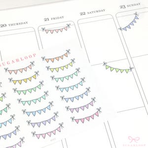 May include: A sheet of colorful party banner stickers with the text "SUGARLOOP" at the top. The stickers feature a variety of pastel colors, including pink, yellow, blue, green, and purple.