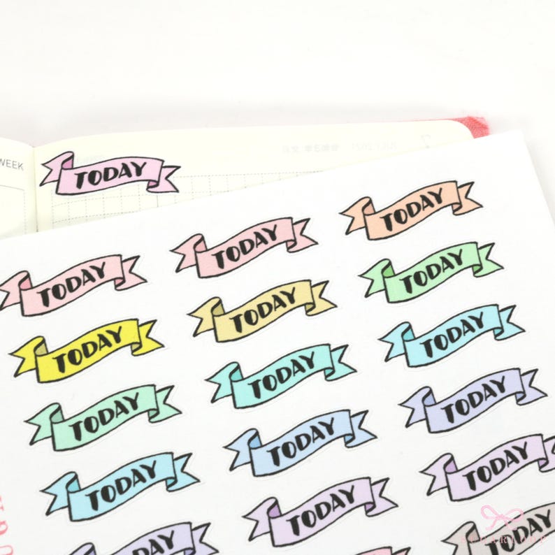May include: A sheet of colorful 'TODAY' banner stickers. The stickers are in various pastel colors, including pink, blue, green, yellow, and purple. Each sticker features a black outline and the word 'TODAY' in black text.