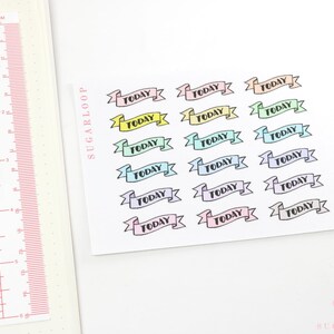 May include: A sheet of pastel-colored banner stickers with the word "TODAY" printed on each banner. The banners are arranged in rows of three.