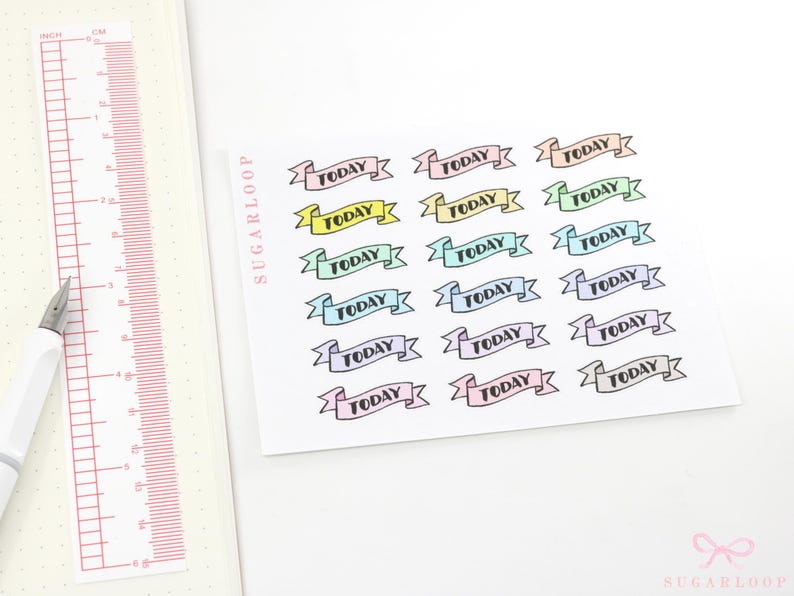 May include: A sheet of pastel-colored banner stickers with the word "TODAY" printed on each banner. The banners are arranged in rows of three.