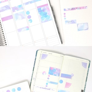 May include: A weekly planner with a grid layout and a variety of colorful stickers. The stickers feature watercolor designs in shades of blue, pink, and purple. The stickers include circles, rectangles, and a decorative border. The planner also includes the text "research project" and "goals".