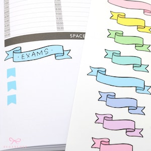 May include: A sheet of colorful decorative stickers with a blue banner that says "EXAMS." The stickers are in the shape of banners with rounded corners and are in various colors, including pink, light blue, blue, green, and yellow.