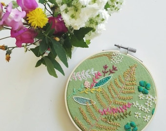 Spring embroidered illustration with wooden hoop - floral textile art on green linen -  botanical wall decor