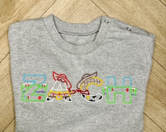 Suéter de Toy Story con nombre personalizado - Sudadera bordada de Pixar para bebés, niños pequeños - ropa de Buzz Lightyear, suéter de Woody, vaquero