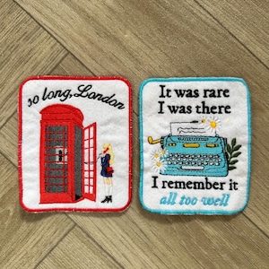 May include: Two embroidered patches. One features a red telephone booth with the text "so long, London." The other shows a blue typewriter with the text "It was rare I was there I remember it all too well."
