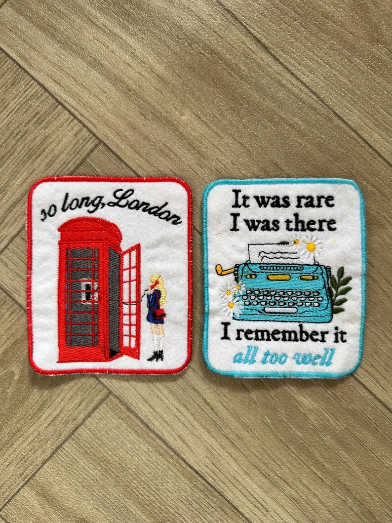 May include: Two embroidered patches. One features a red telephone booth with the text "so long, London." The other shows a blue typewriter with the text "It was rare I was there I remember it all too well."