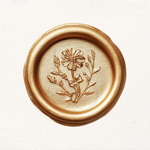May include: A gold wax seal with a detailed floral design featuring a flower and leaves.
