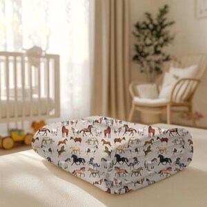 "Folded horse blanket in nursery – velveteen plush equestrian throw, cozy rustic kids’ room bedding or farmhouse horse lover gift."