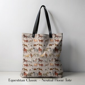 Minimalist display of horse-themed tote bag in a neutral palette. Features multiple hand-illustrated horse breeds and strong black handles. A classic, durable option for equestrians, barn girls, and country lovers. Makes a timeless gift for riders who value understated style, practicality, and horse-themed accessories for daily life.