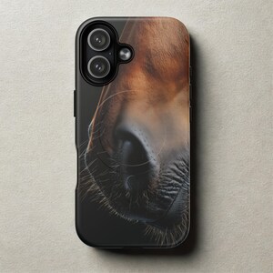 May include: A black phone case featuring a close-up of a horse's nose. The case has a glossy finish and a detailed image of the horse's brown and black muzzle, with visible whiskers and nostrils. The phone's camera lenses are visible at the top.