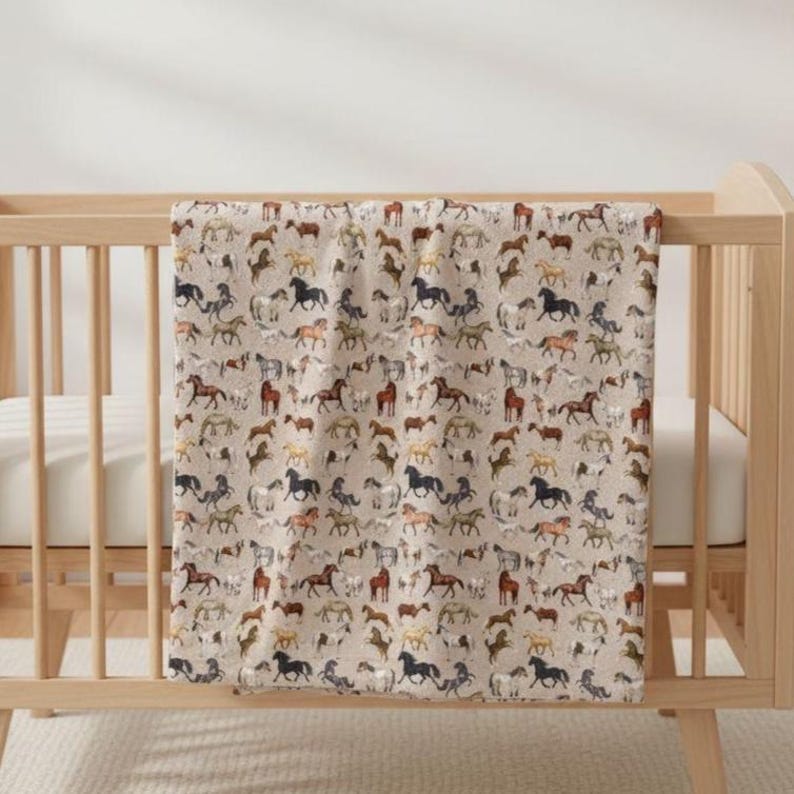 Beige horse plush blanket draped over crib, nursery horse decor, soft velveteen baby blanket look, horse themed nursery gift, western baby room decor, neutral nursery bedding, equestrian baby gift, cozy plush throw, horse lover nursery, rustic kids room decor, farmhouse nursery blanket, horse girl nursery theme, aesthetic neutral baby room, soft comfort blanket, country nursery styling