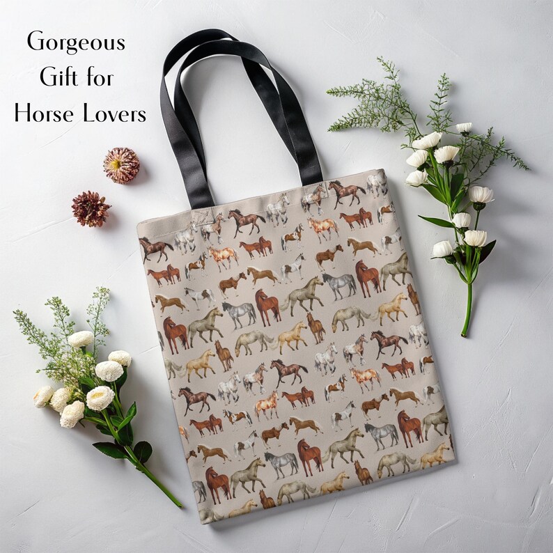 Horse-themed tote bag styled with fresh flowers and giftable energy. This equestrian tote is a perfect present for birthdays, holidays, or barn besties. With a charming neutral background and strong stitched handles, it's both functional and thoughtful—an aesthetic and practical gift idea for moms, riders, and rustic decor lovers.