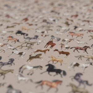 close up horse pattern blanket, detailed multi horse design plush fleece, equestrian throw texture soft material