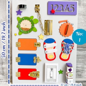 May include: A wooden busy board, 19.7 inches tall and 14.6 inches wide, features various interactive elements. It includes latches, a chain, a light switch, numbers, and a turtle-shaped element. The board is designed for sensory and fine motor skill development.