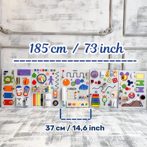 May include: A large, multi-panel wooden activity board, 73 inches long and 14.6 inches wide, featuring various interactive elements like gears, switches, and beads in bright colors. The board includes numbers and shapes.