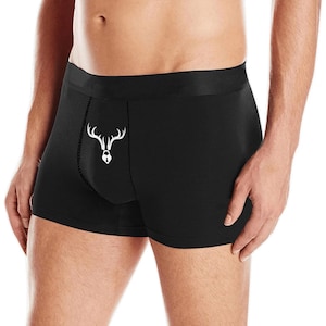 May include: Black boxer briefs with a white graphic of a deer head with antlers and a padlock on the front.