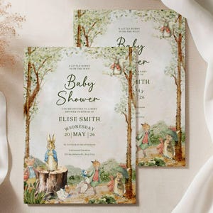 May include: Two baby shower invitations with a watercolour illustration of Peter Rabbit and friends. The invitations feature the text "Baby Shower" and event details, including the name Elise Smith and the date May 20th.