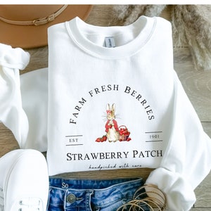 Strawberry rabbit shirt | Peter rabbit strawberry sweater | Strawberry farm sweatshirt | Peter rabbit sweater, Foodie shirt, Beatrix Potter